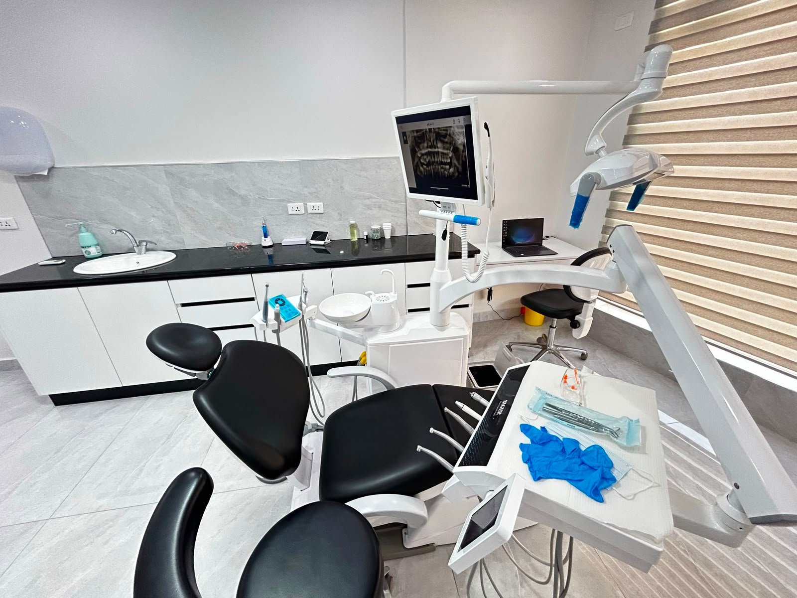 Implant follow-up appointment at a dental clinic in Tabarbour Amman
